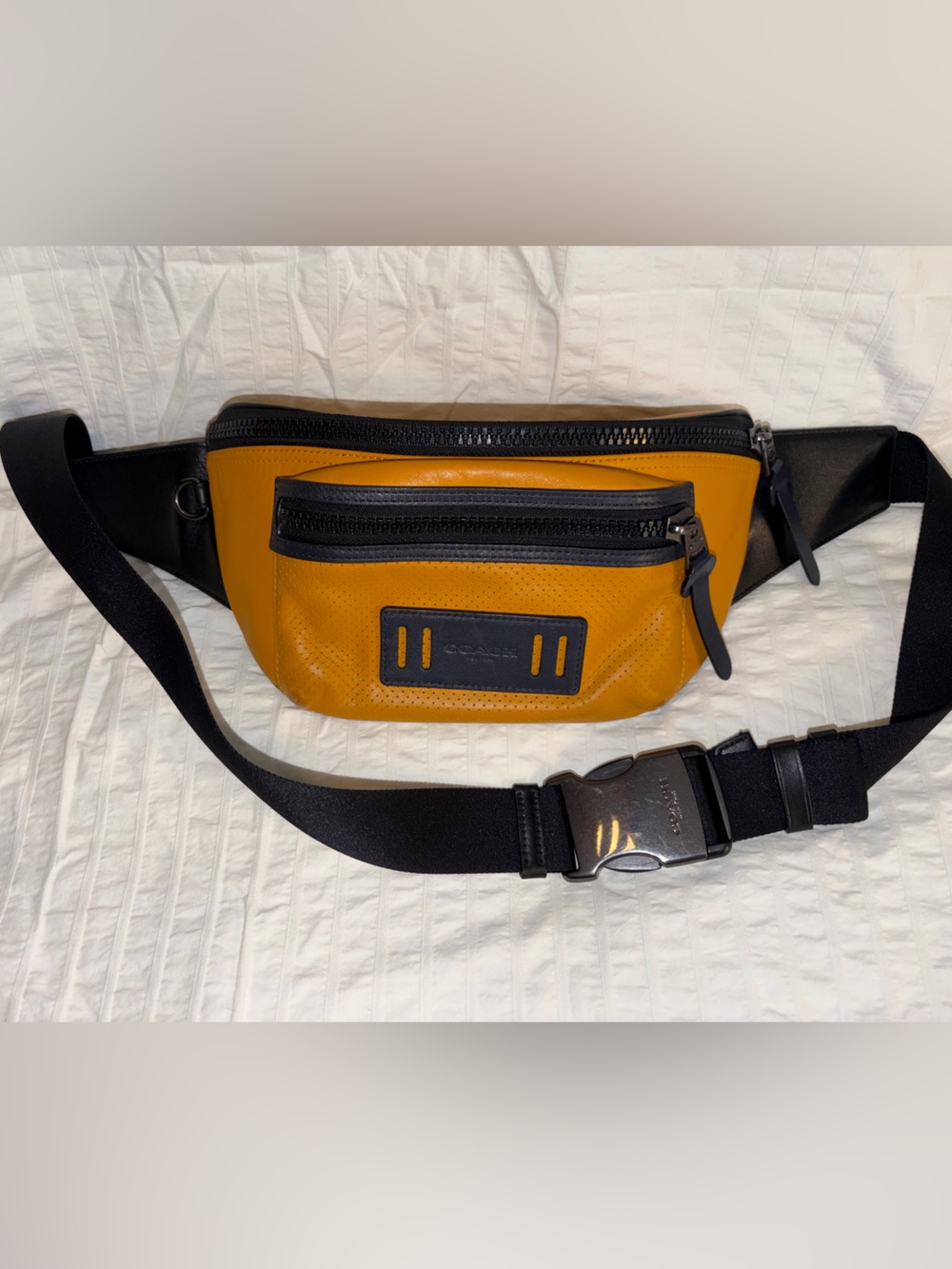 Coach Men's Orange and Black Leather Belt Bag with original zipper pull and tag.